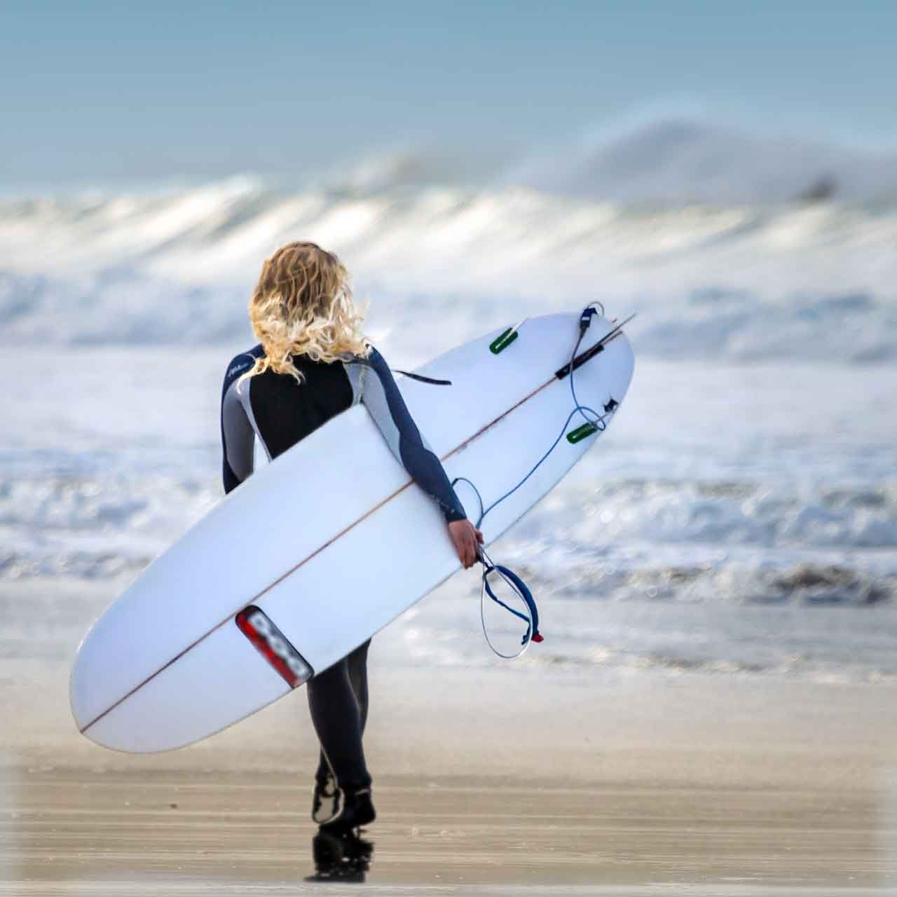 female surfer on beach